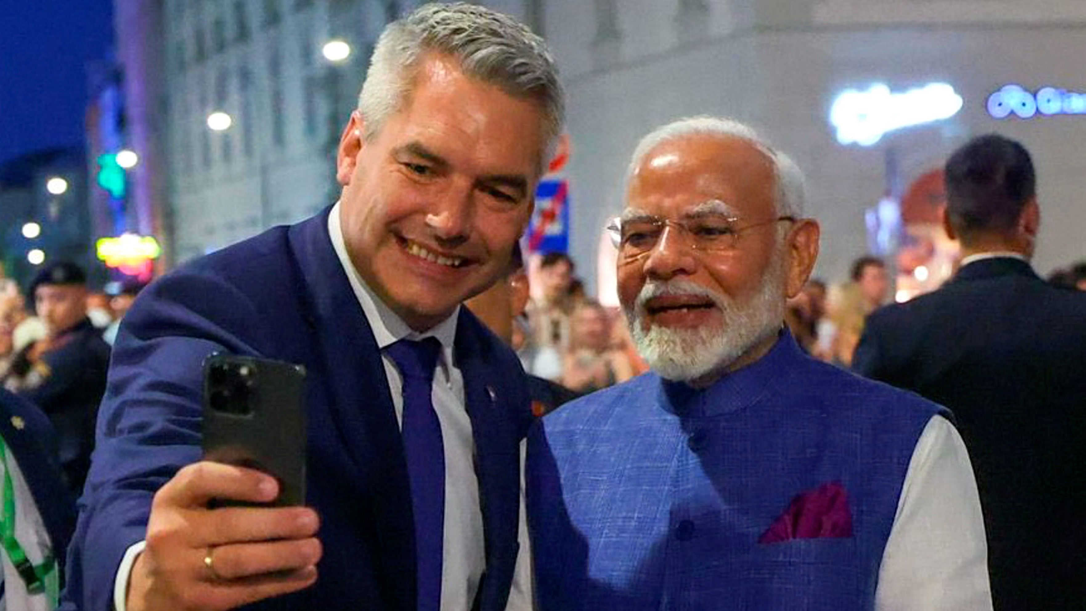 <div class="paragraphs"><p>Federal Chancellor of the Republic of Austria Karl Nehammer clicks a selfie with Prime Minister Narendra Modi in Vienna.</p></div>